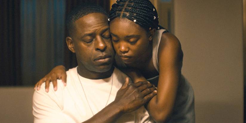 Xavier (Sterling K. Brown) and Presley (Aliyah Mastin) embrace while closing their eyes in Paradise (2025) Season 1 Ep 8