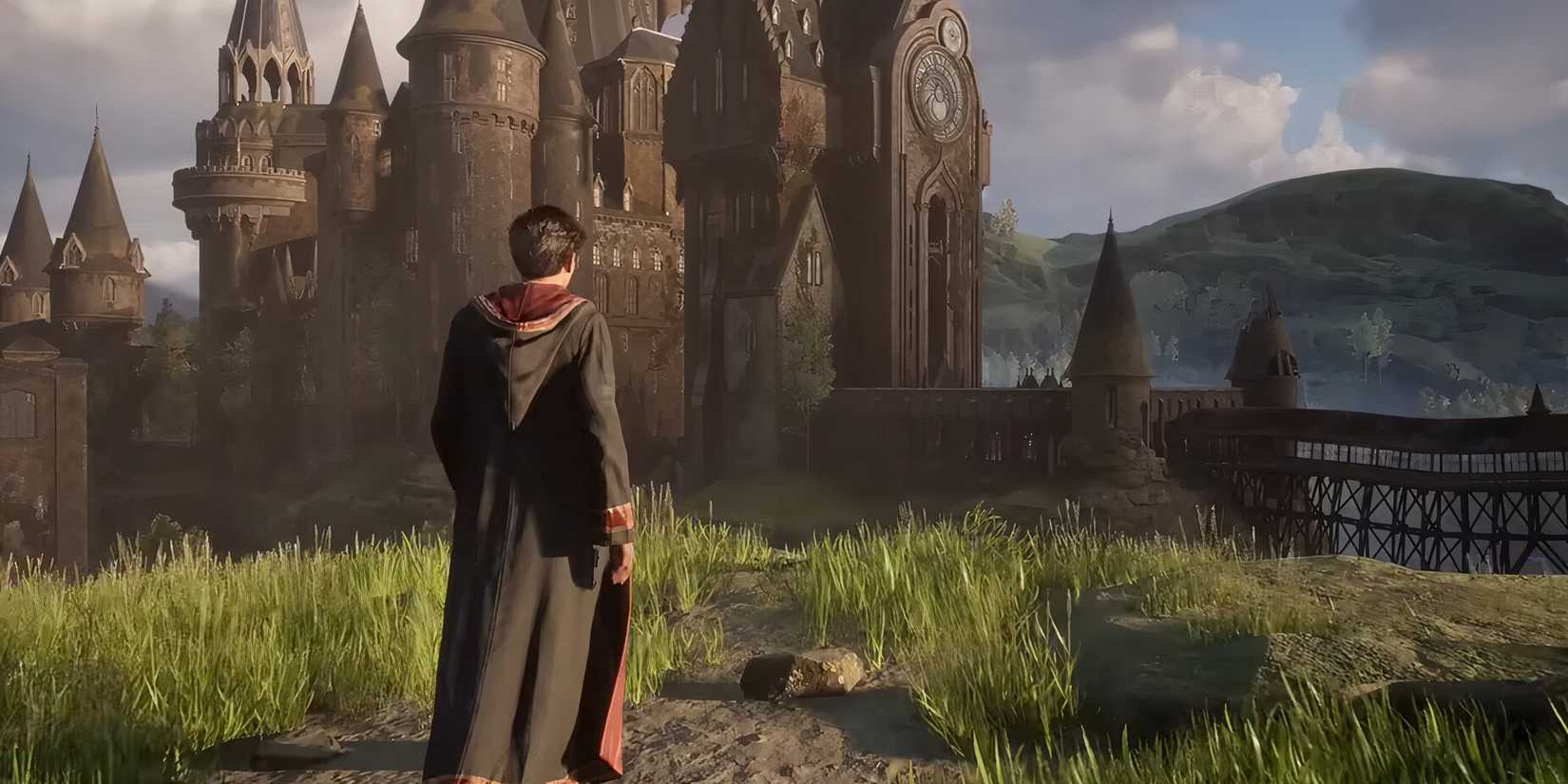 Player standing outside Hogwarts Castle in Hogwarts Legacy.