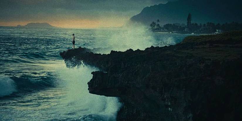 Ryan standing at the edge of a cliff over the ocean in Hawaii in Reeling