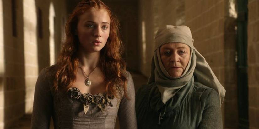 Sansa and Septa Mordane looking scared in Game Of Thrones Season 1 Episode 8