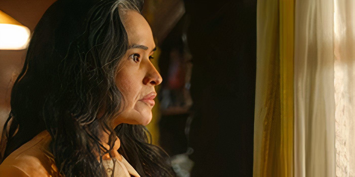 Deanna Allison as Emma Leaphorn looks out a window in Dark Winds season 3