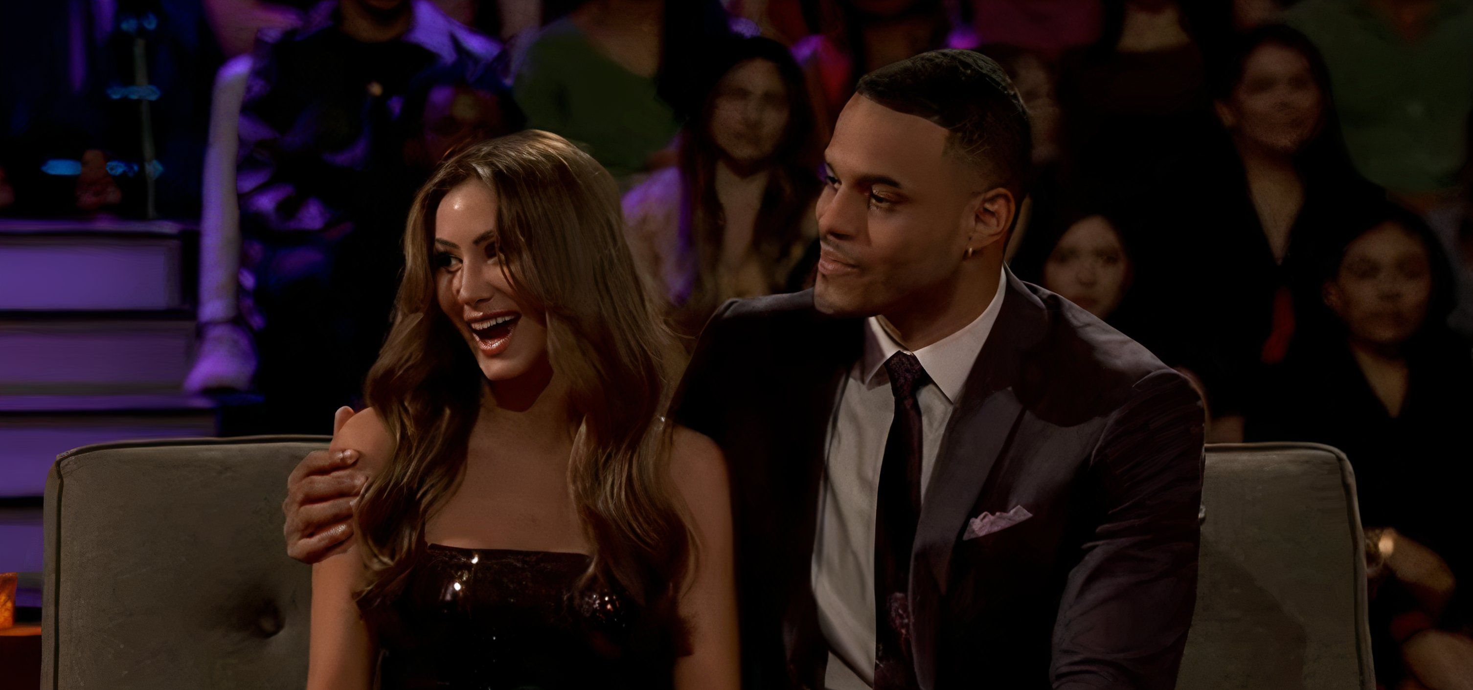 Grant Ellis sitting with his arm around Juliana Pasquarosa on The Bachelor finale