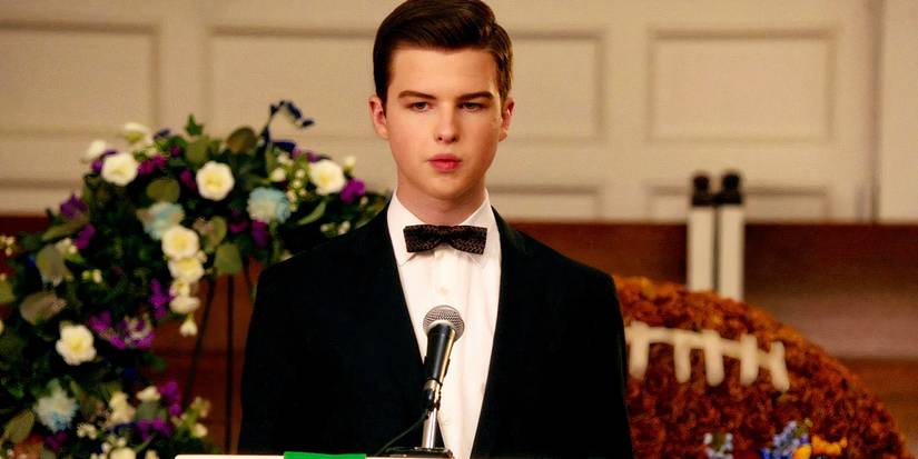 Sheldon (Iain Armitage) lost in thought, attempts to give a speech for his father at his funeral in Young Sheldon season 7  episode 13