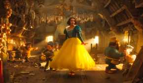 Snow White (Rachel Zegler) dances with the seven dwarves in Snow White (2025)