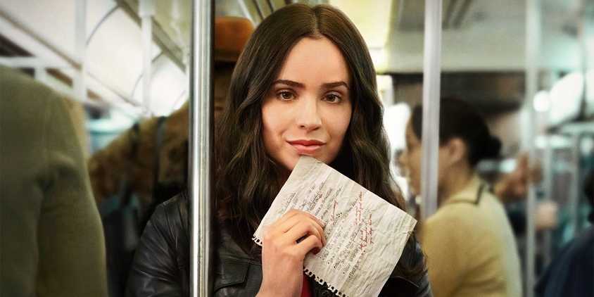 Sofia Carson standing on a subway holding her list on the poster for The Life List