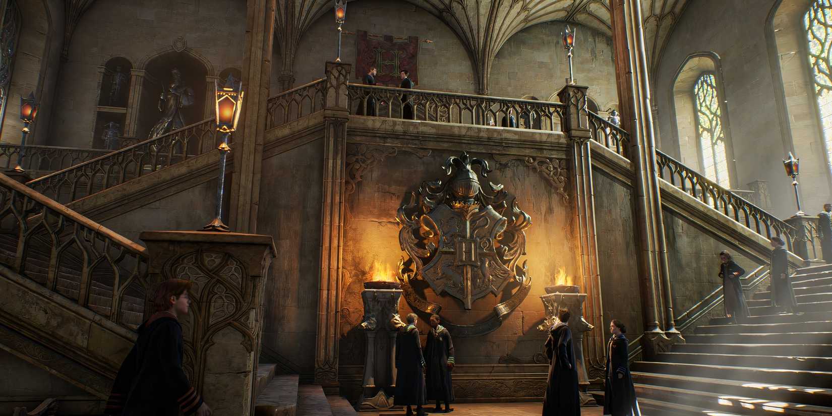 Students stand around the hallways of Hogwarts Legacy.