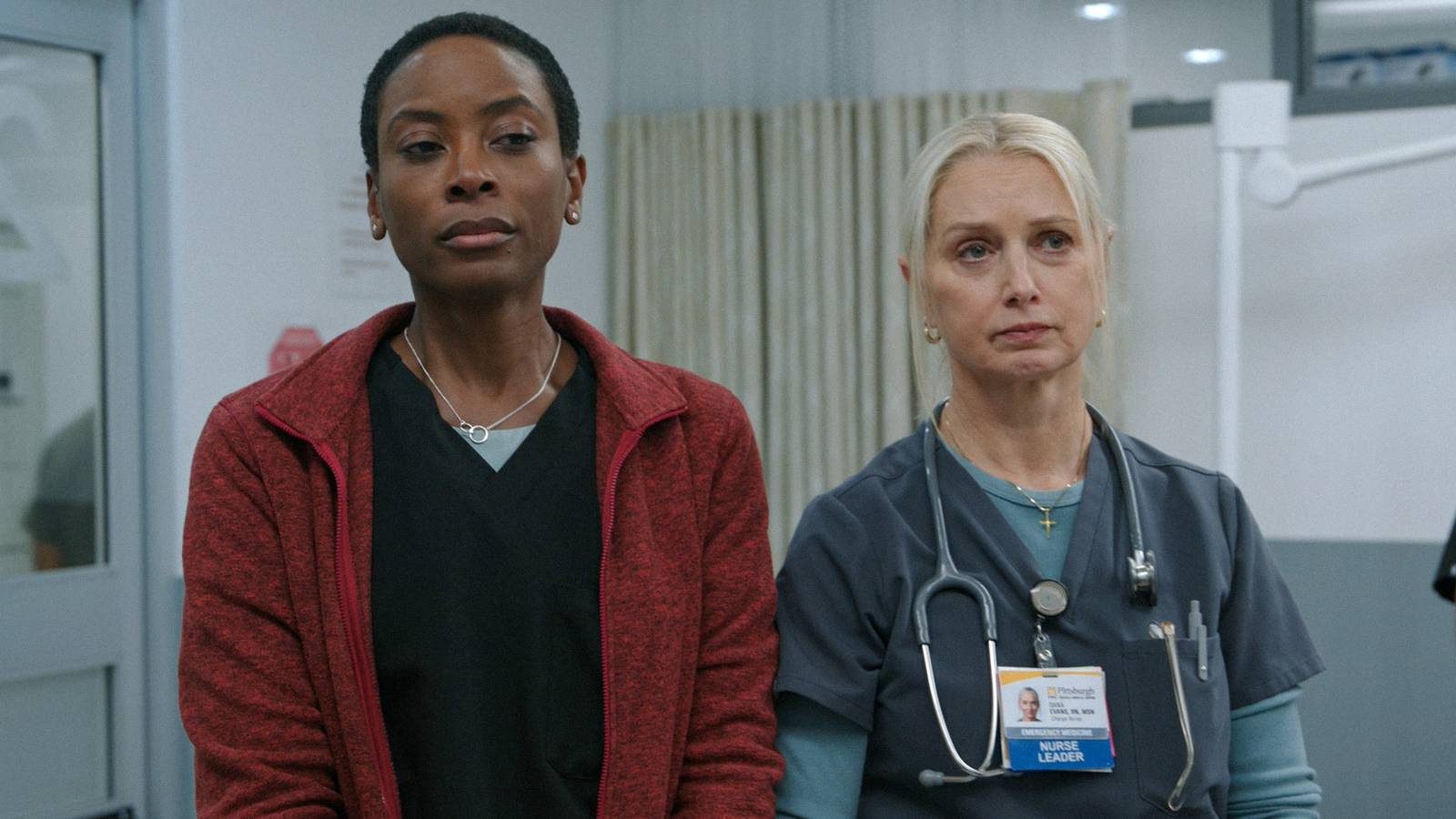 Dr. Heather Collins (Tracy Ifeachor) and Nurse Dana Evans (Katherine LaNasa) looking downcast in The Pitt Season 1 Ep 9