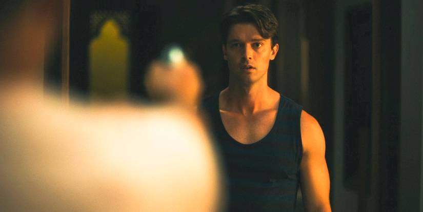 Timothy aiming a gun at Saxon (Patrick Schwarzenegger) in The White Lotus Season 3 Ep 7