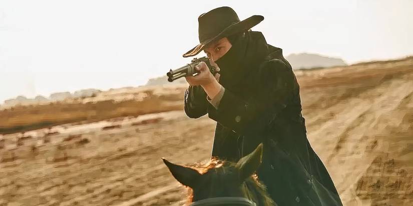 Kim Nam-gil as Lee Yoon points a gun in Song of the Bandits