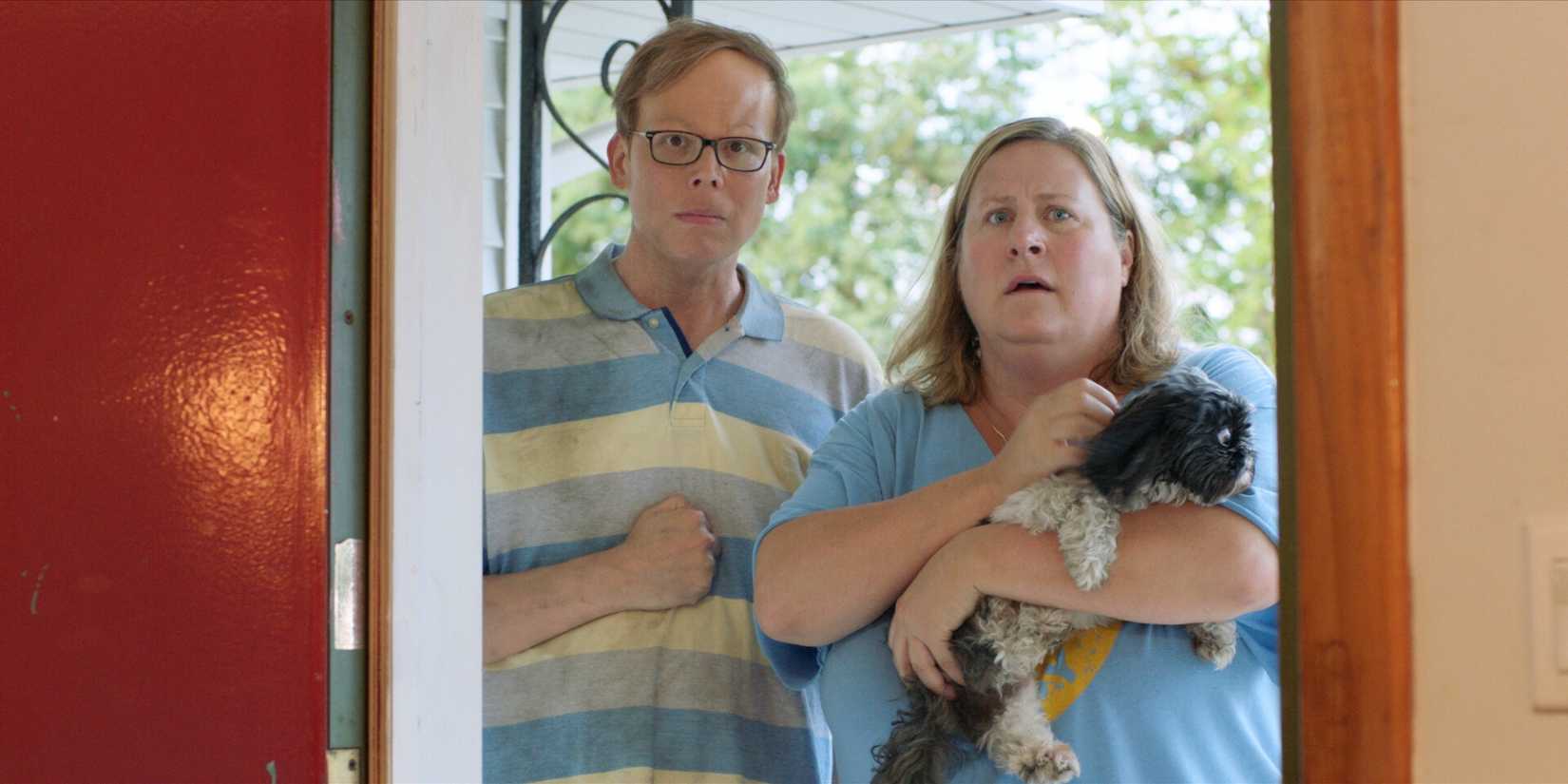HBO Max Shows With 100% Rotten Tomatoes Score: Top Ranked List 5 Jeff Hiller and Bridget Everett stand in a doorway with a small dog