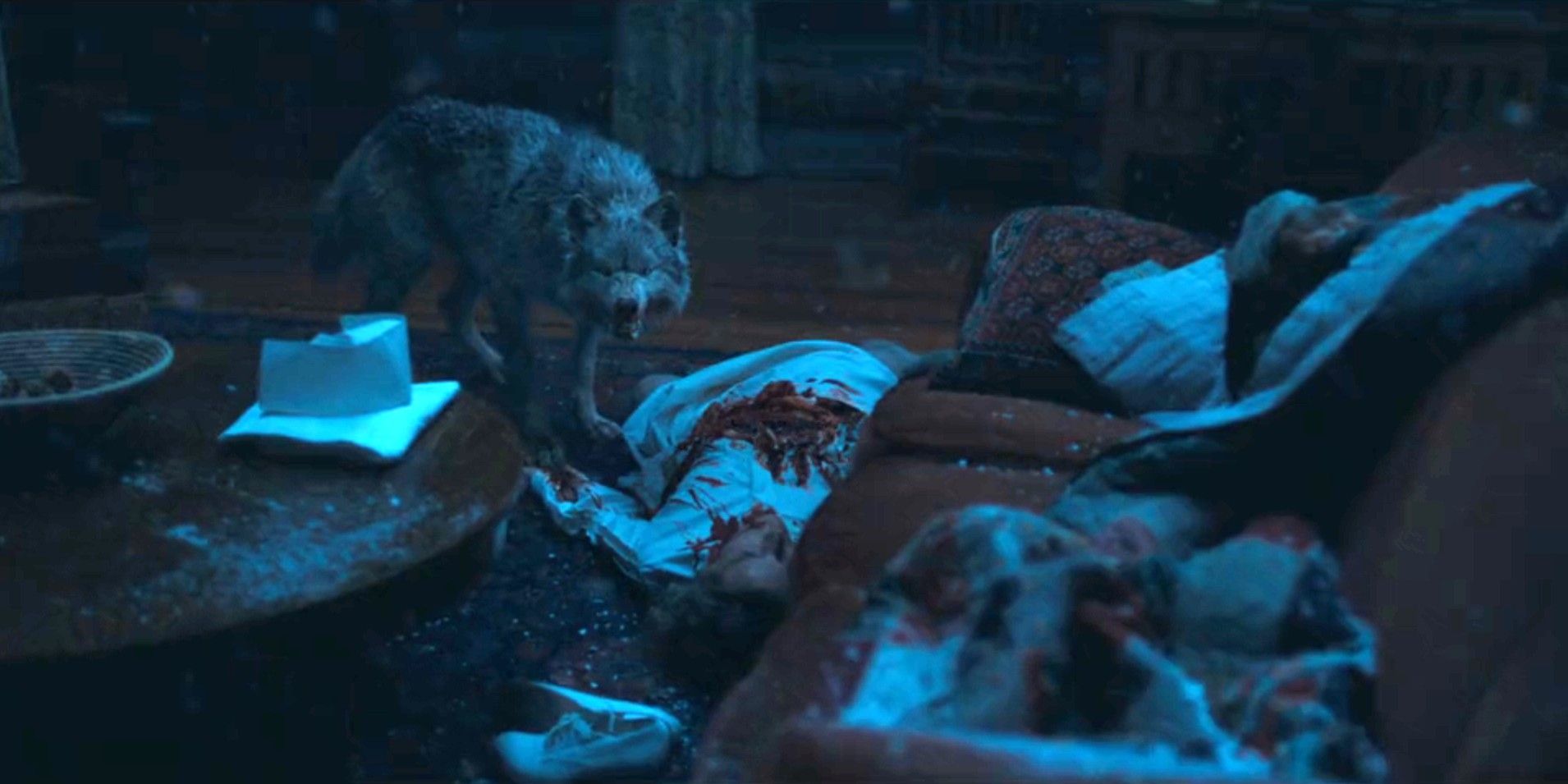 A wolf standing over the dead nurse and snarling in 1923 season 2, episode 2