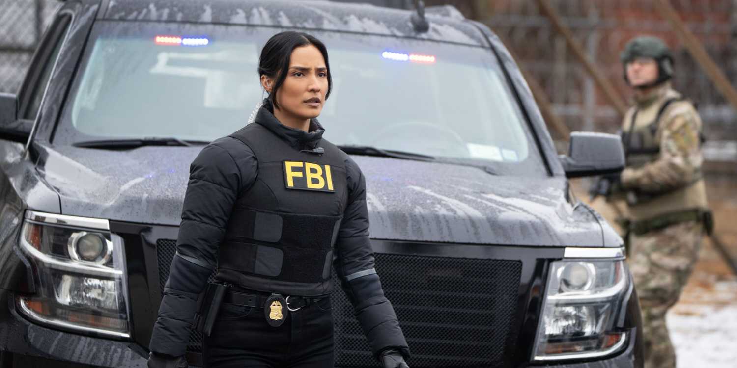 FBI Dani standing in front of a car where a guy in camoflauge is holding a gun