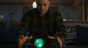 Harry admiring his device in Resident Alien