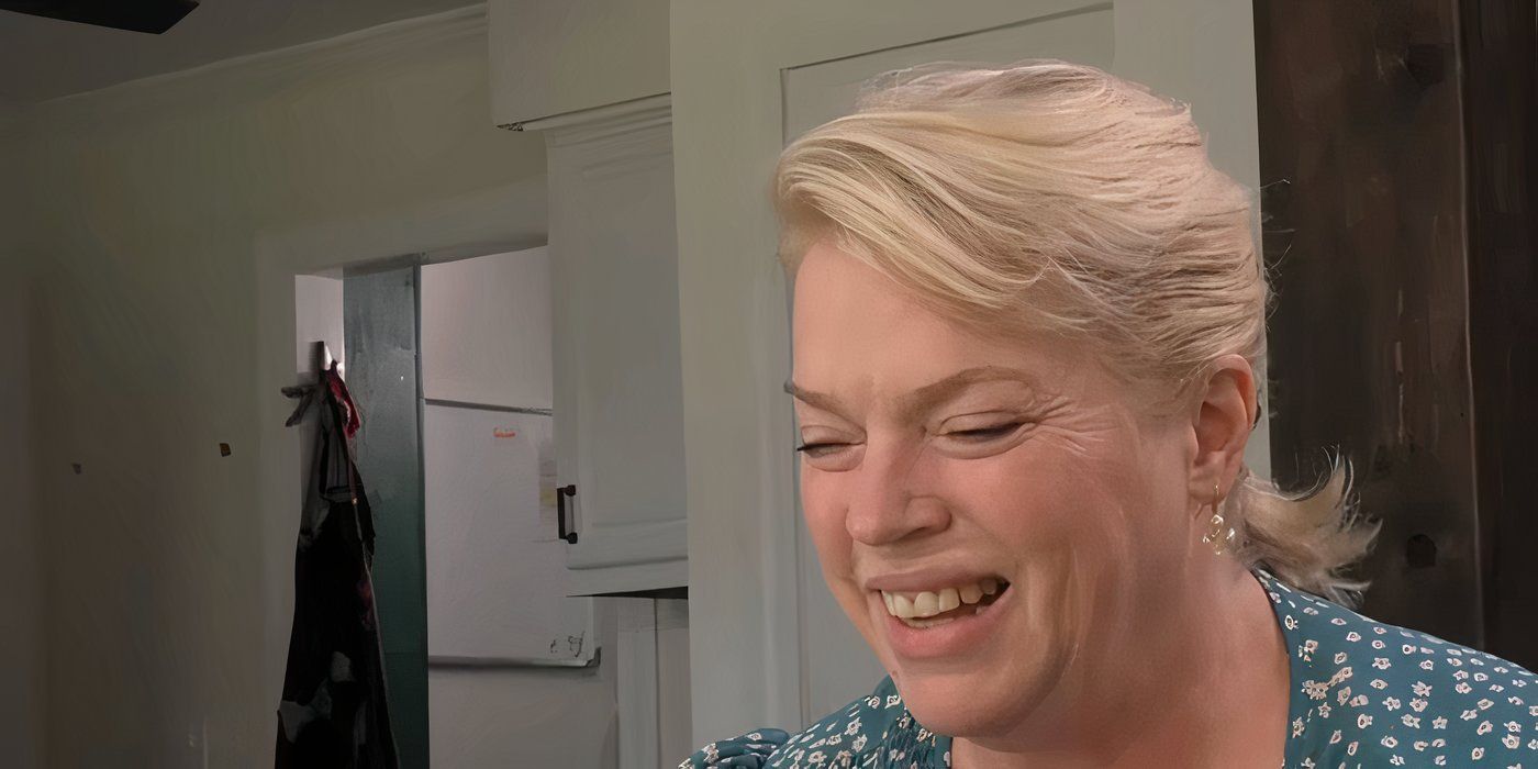 Janelle Brown smiling and looking down on Sister Wives