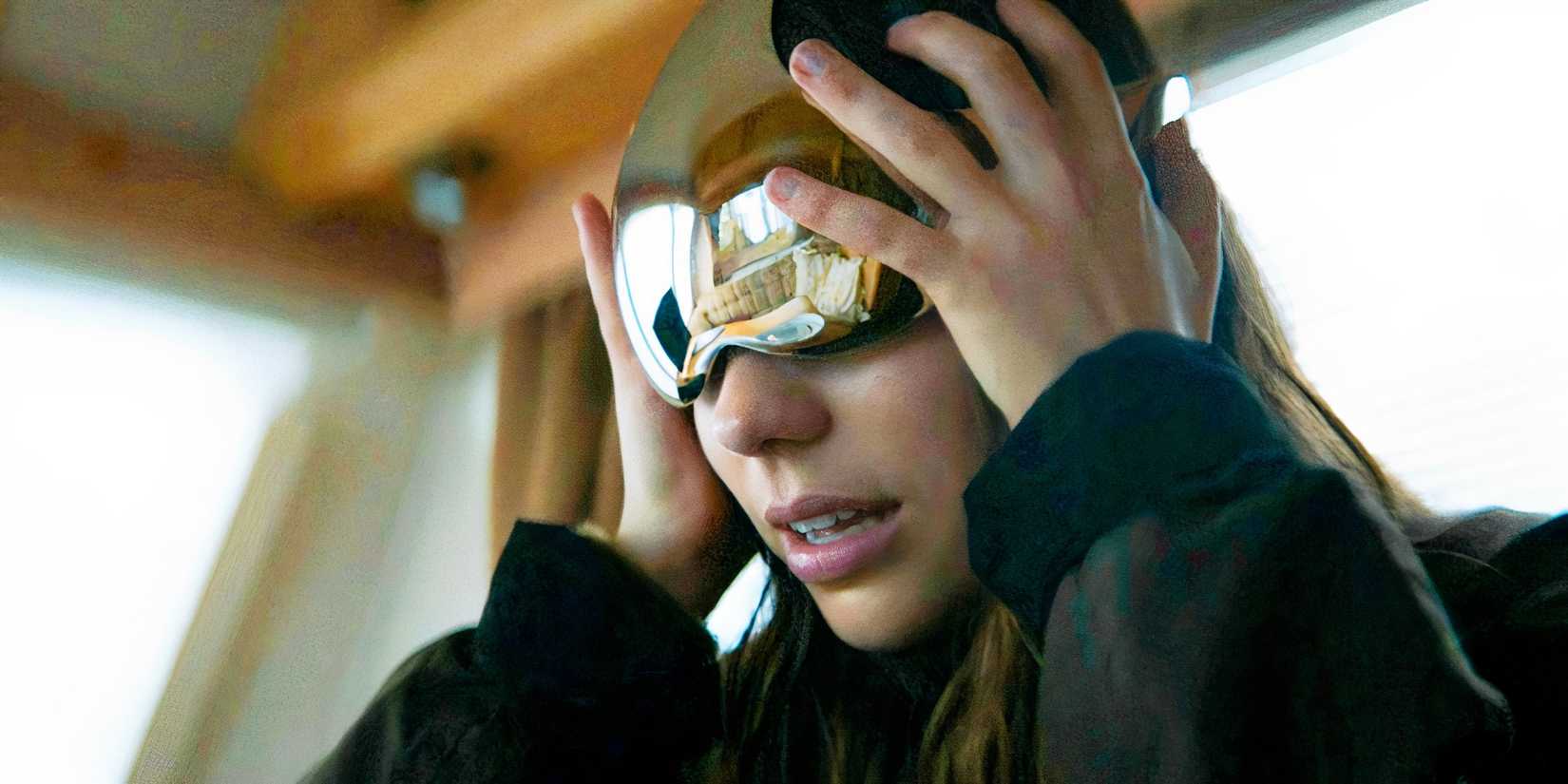 A woman dons an alternate reality helmet in 3 Body Problem