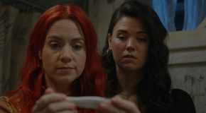 D'arcy and Kate looking at a pregnancy test in Resident Alien