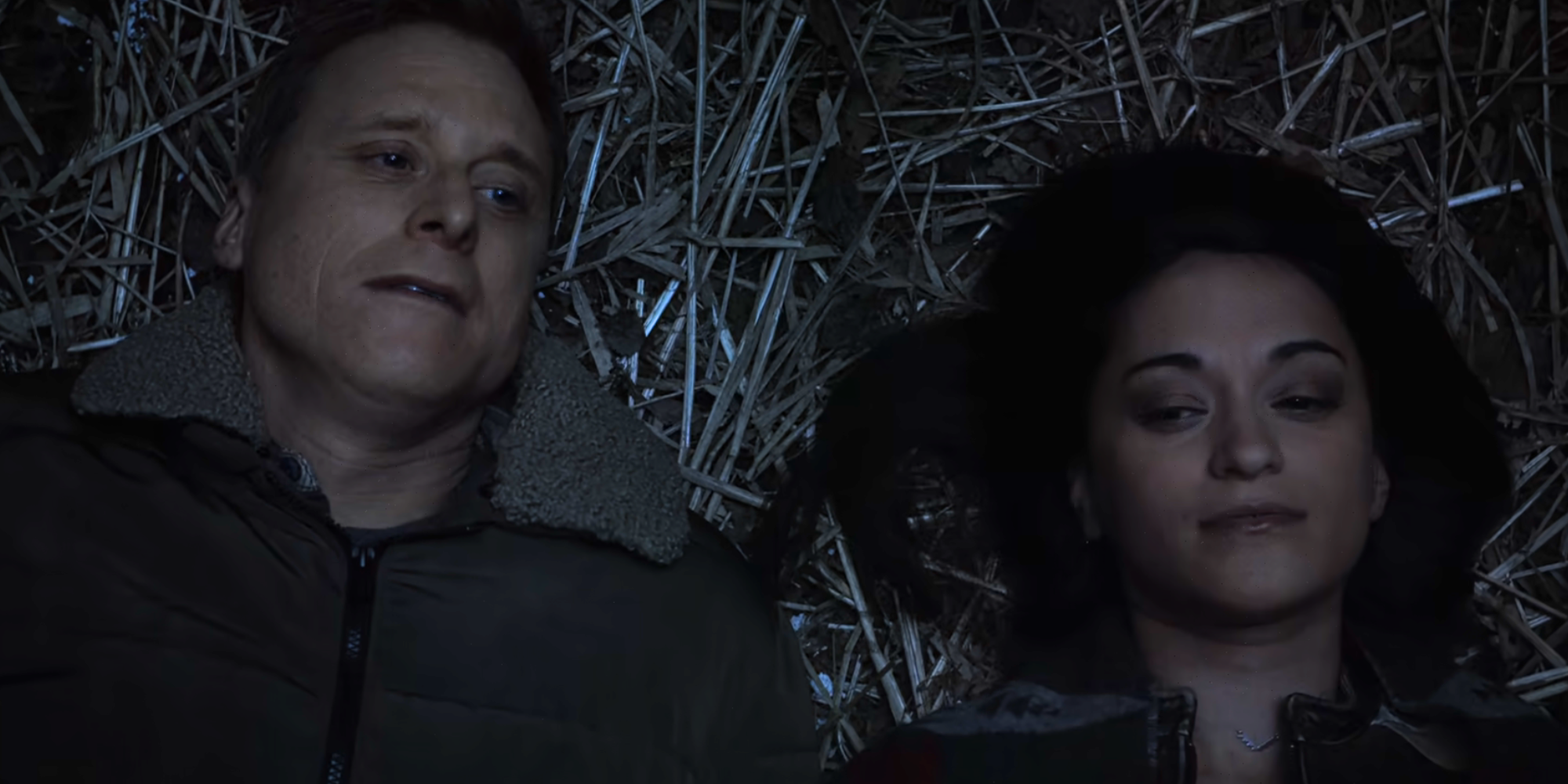 Harry and Asta on the ground looking at the stars in Resident Alien