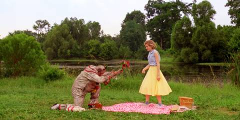 American Horror Story Freak Show Twisty giving flowers to his victim