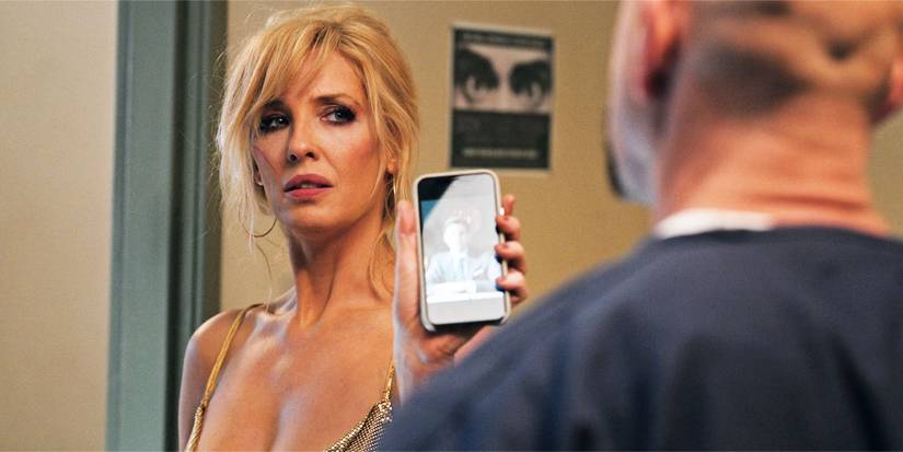 Beth Dutton in Yellowstone season 4, episode 10, holding up her phone