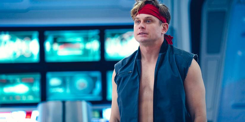 Karl (Billy Magnussen) wearing a red headband in Black Mirror Season 7 Ep 6