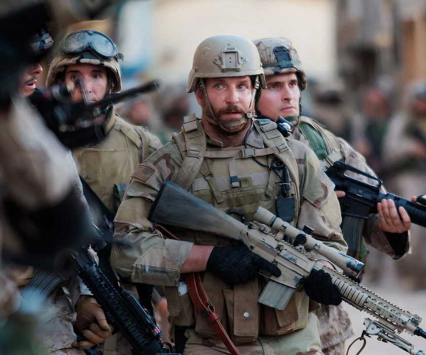 Bradley Cooper as Chris Kyle leads a team of soldiers in American Sniper