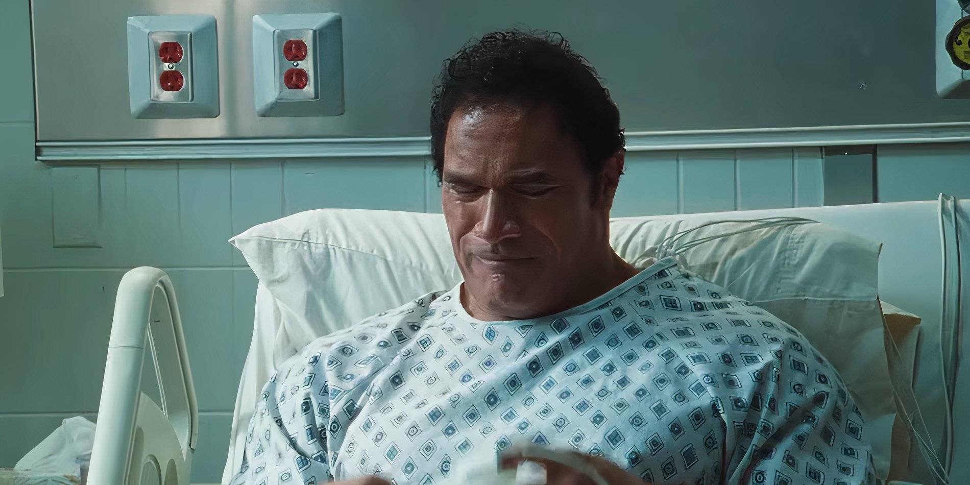 Dwayne Johnson in a hospital bed in The Smashing Machine