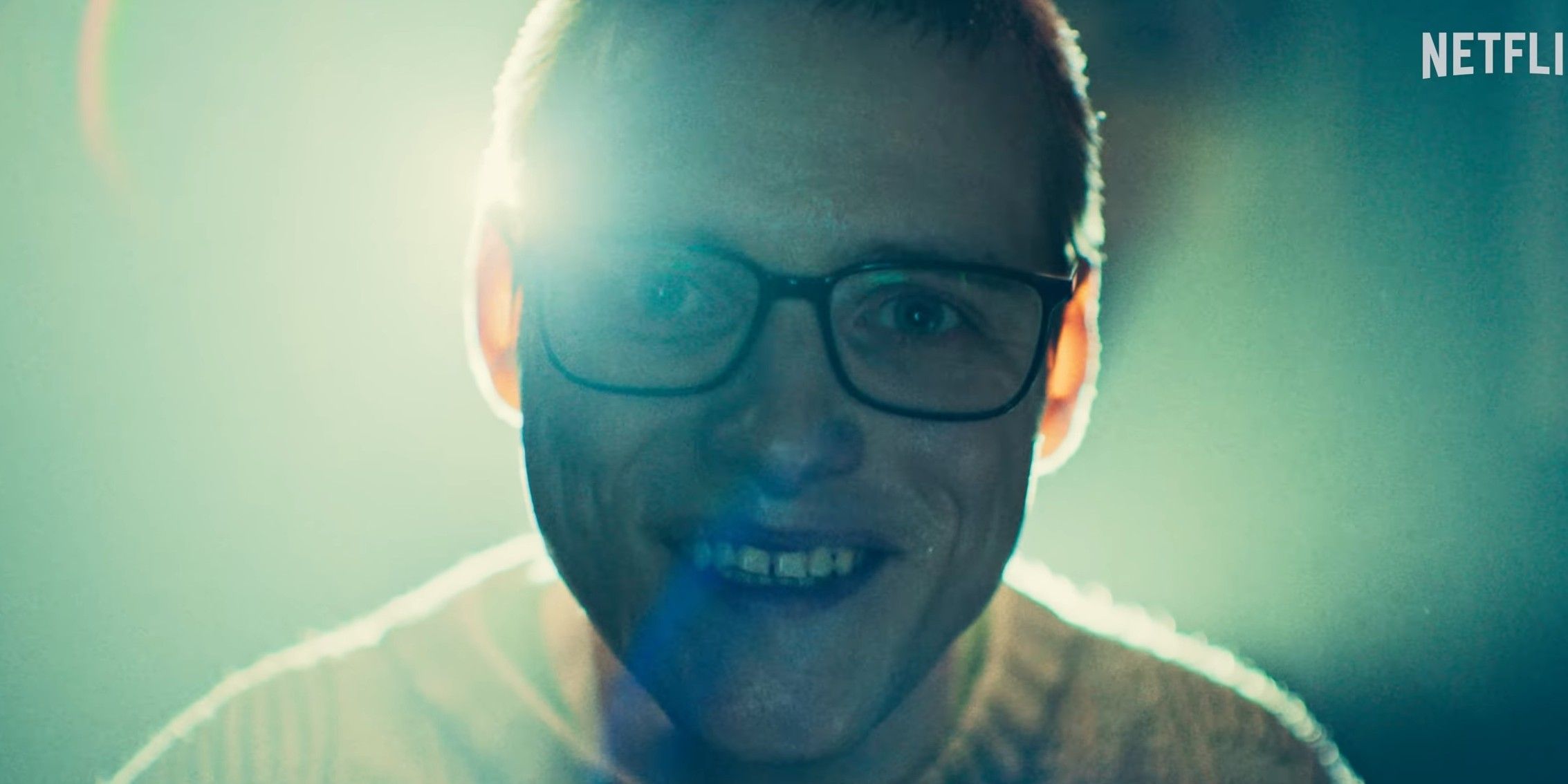 Lewis Gribben as Younger Cameron Walker smiling in Black Mirror season 7, episode 4, 