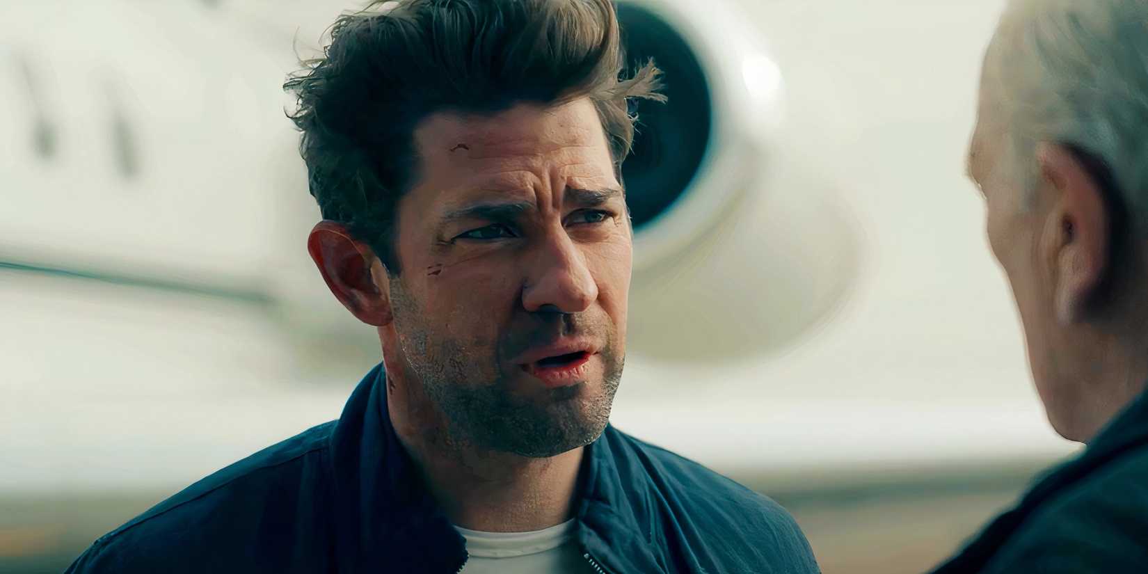 John Krasinski standing in front of a private jet in Jack Ryan season 4