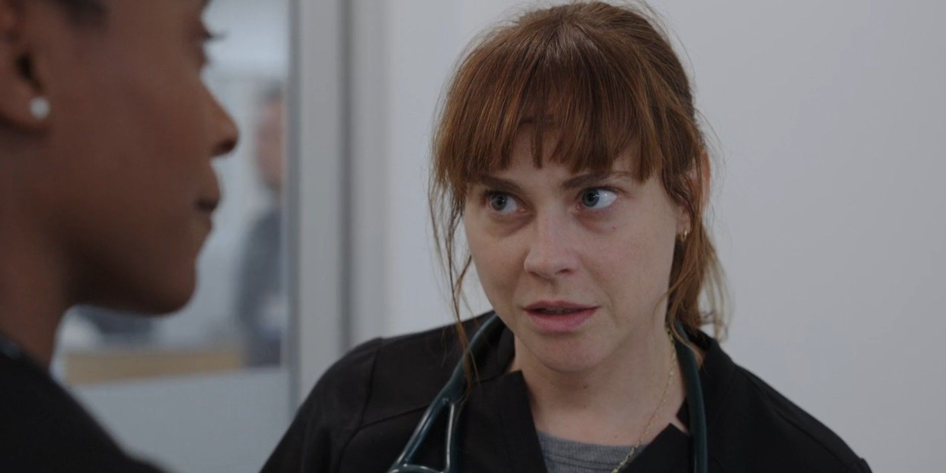 Dr. McKay (Fiona Dourif) looking defensive while speaking to Dr. Collins in The Pitt season 1, episode 9