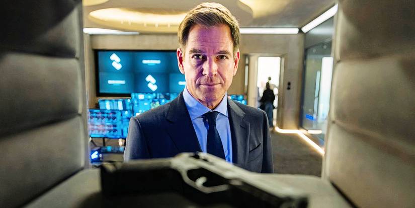 Michael Weatherly lookin at the case with a gun in NCIS: Tony & Ziva