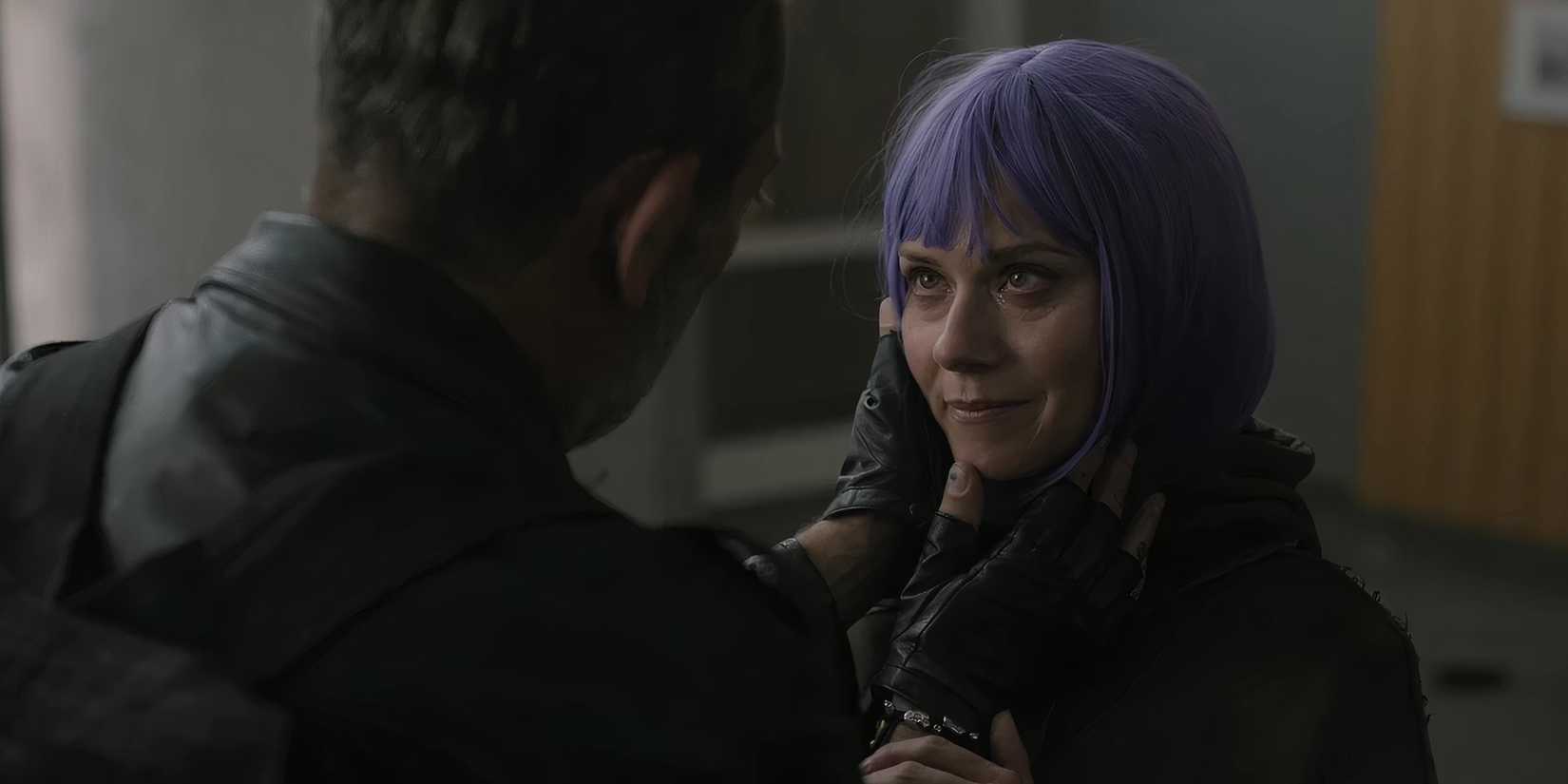 Negan (Jeffrey Dean Morgan) holding Lucille's (Hilarie Burton) face as she looks into his eyes in The Walking Dead: Dead City season 2