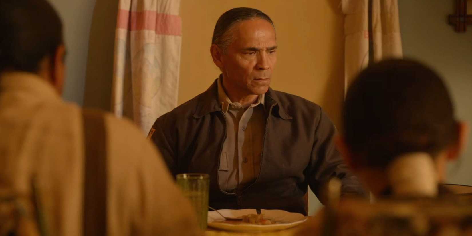 Joe Leaphorn (Zahn McClarnon) eating a family dinner during his hallucination in Dark Winds season 3, episode 6