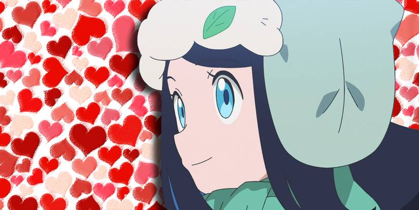 Liko in her winter gear in front of a field of hearts.