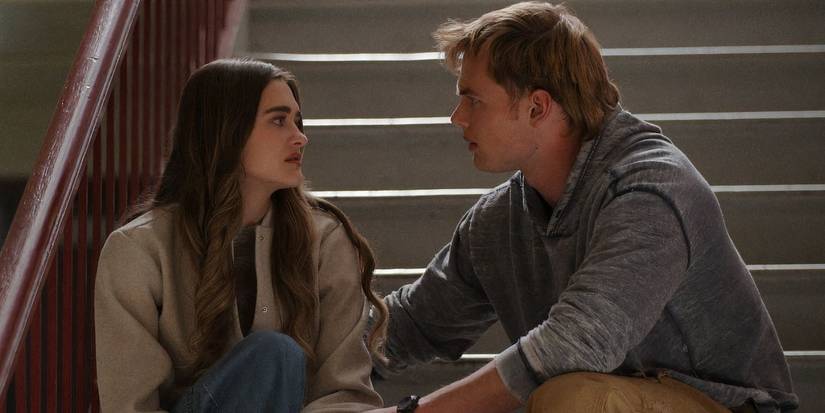 Lauren and Lucas talks seriously while sitting on the stairs in Ransom Canyon