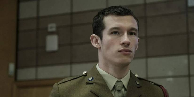 Callum Turner standing in a costume in The Capture