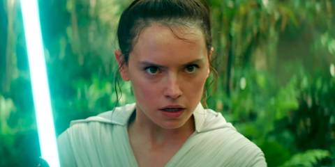 Rey holding a light saber in The Rise of Skywalker