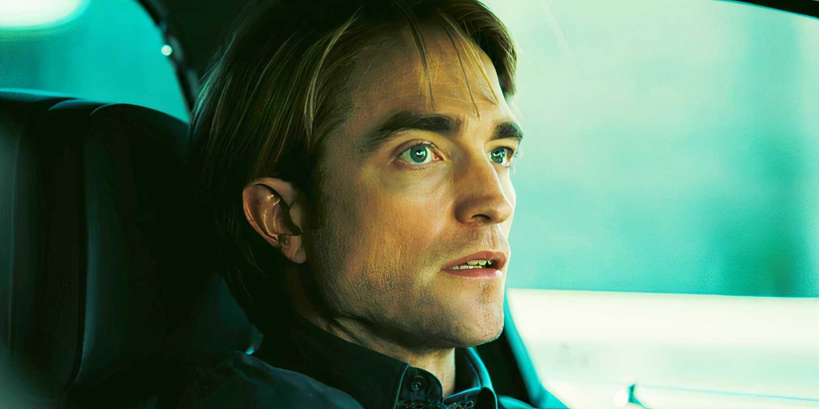 Robert Pattinson looking worried in a car in Tenet