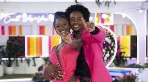 Love Island USA's Serena Page and Kordell Beckham with their arms around each other, holding up a 1 sign