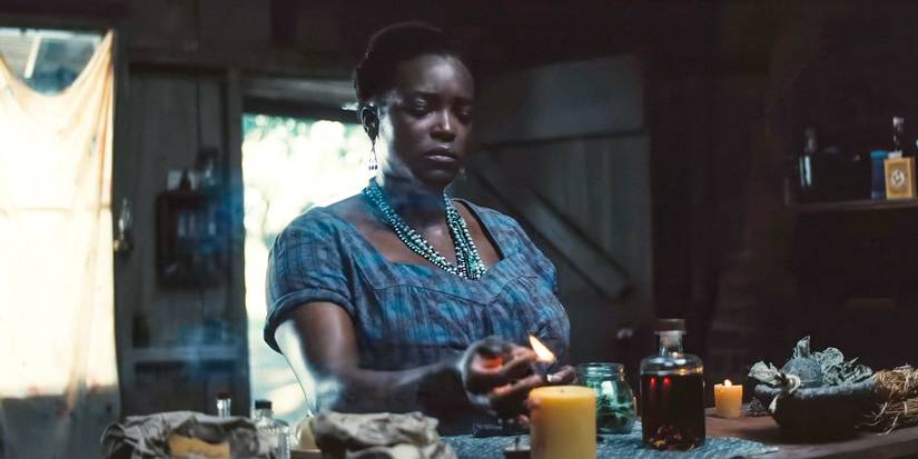 Annie ( Wunmi Mosaku) is doing some mystical thing in Sinners