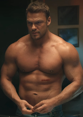 Alan Ritchson as Jack Reacher in Reacher (2022) Season 2, tending to an torso wound