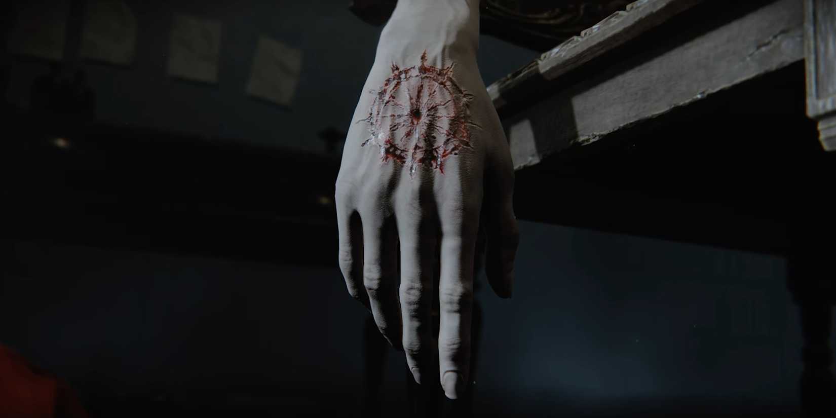 A rune is carved into a hand in the Duskbloods.