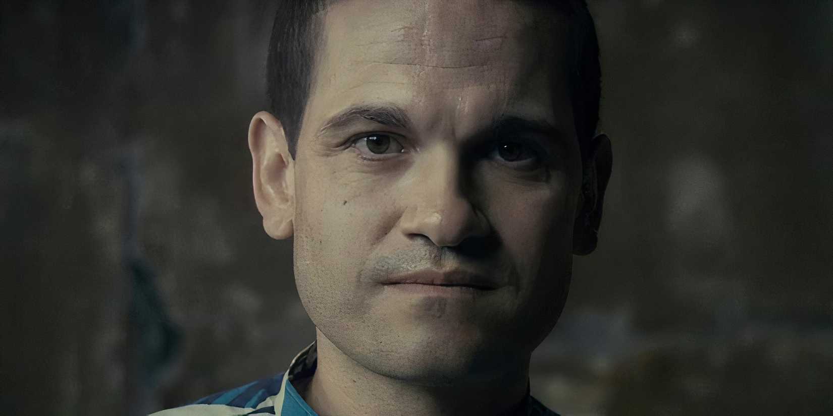 A man looks into the camera.
