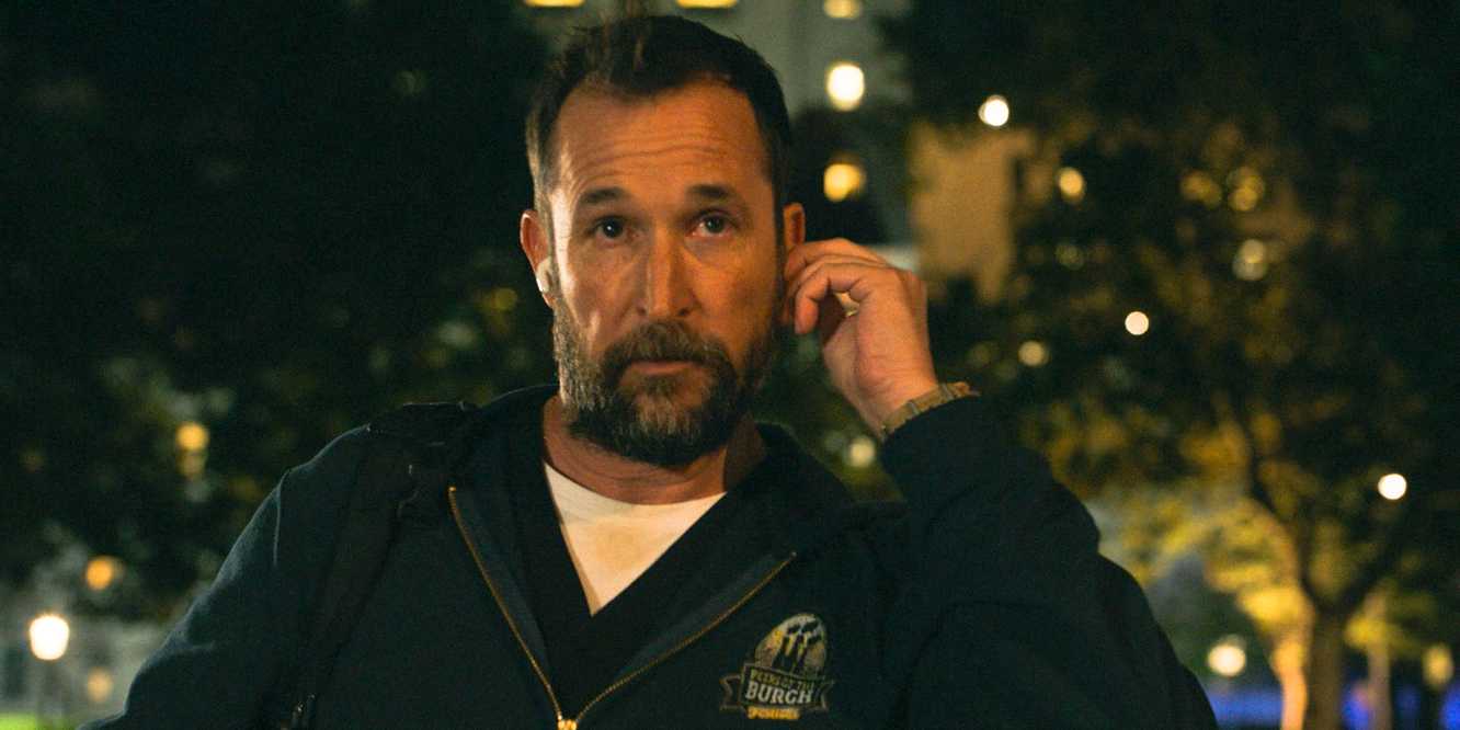 Dr. Robi (Noah Wyle) putting on his earphones in The Pitt Season 1 Ep 15