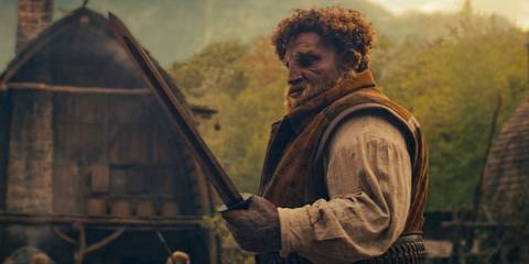 Loial (Hammed Animashaun) observing a sword in The Wheel of Time Season 3 Ep 7
