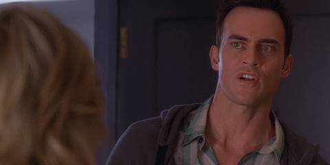 Cheyenne Jackson as Danny looking over Jenna's shoulder at something in 30 Rock.