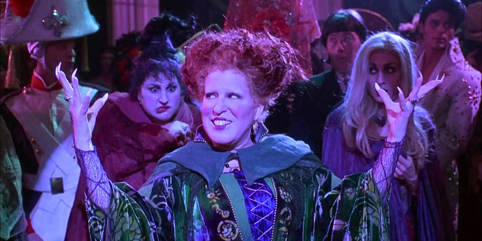 Bette Midler as Winifred posing in front of a large crowd in Hocus Pocus
