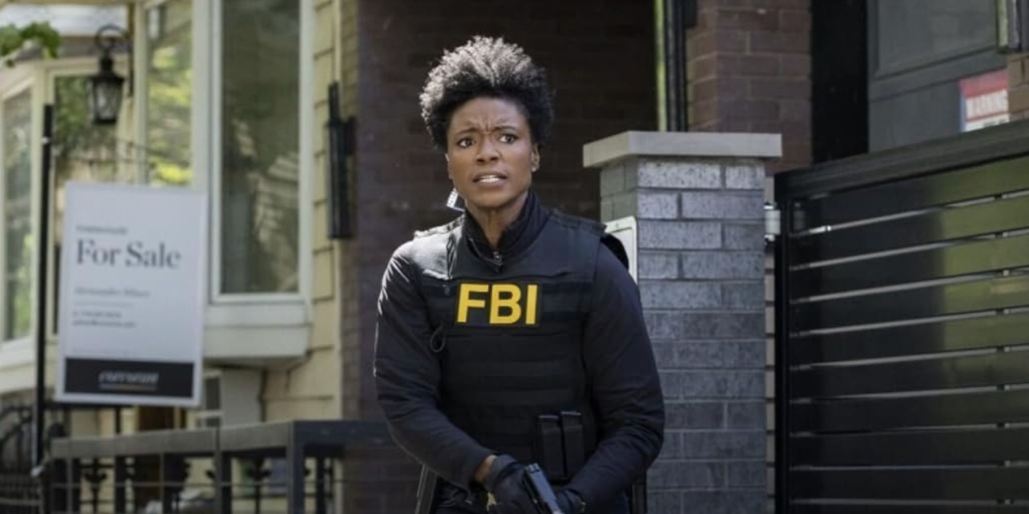 Katherine Renee Kane as Tiffany in FBI gear holding a gun