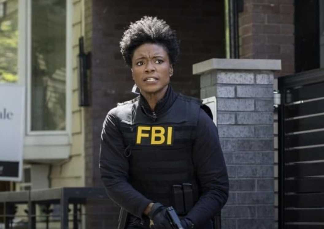 Katherine Renee Kane as Tiffany in FBI gear holding a gun