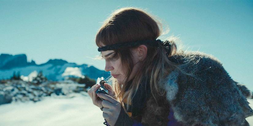 Teen Natalie (Sophie Thatcher) talking on the satellite phone in Yellowjackets Season 3 Ep 10