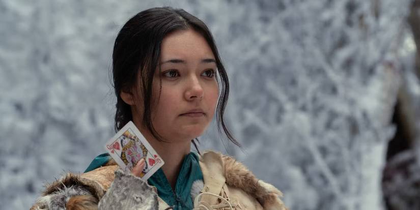 Mari (Alexa Barajas) holding up the Queen of Hearts card in the Yellowjackets season 3 finale